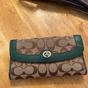 Brown and green coach wallet